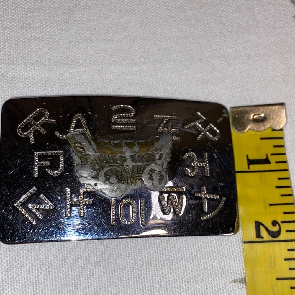 Chambers Belt Co. USA Belt‎ Buckle Featuring Covered Wagon Branding Marks